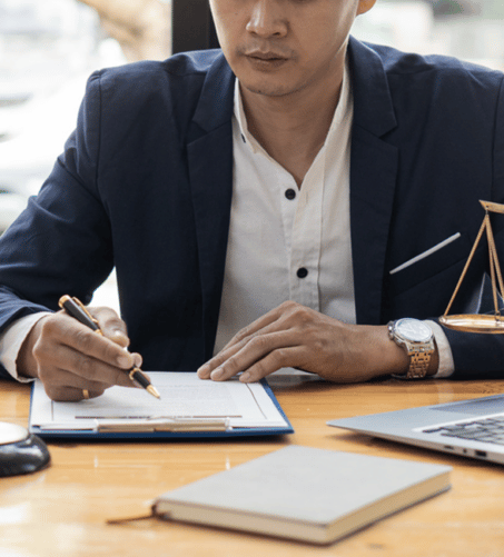 male lawyer working on legal documents